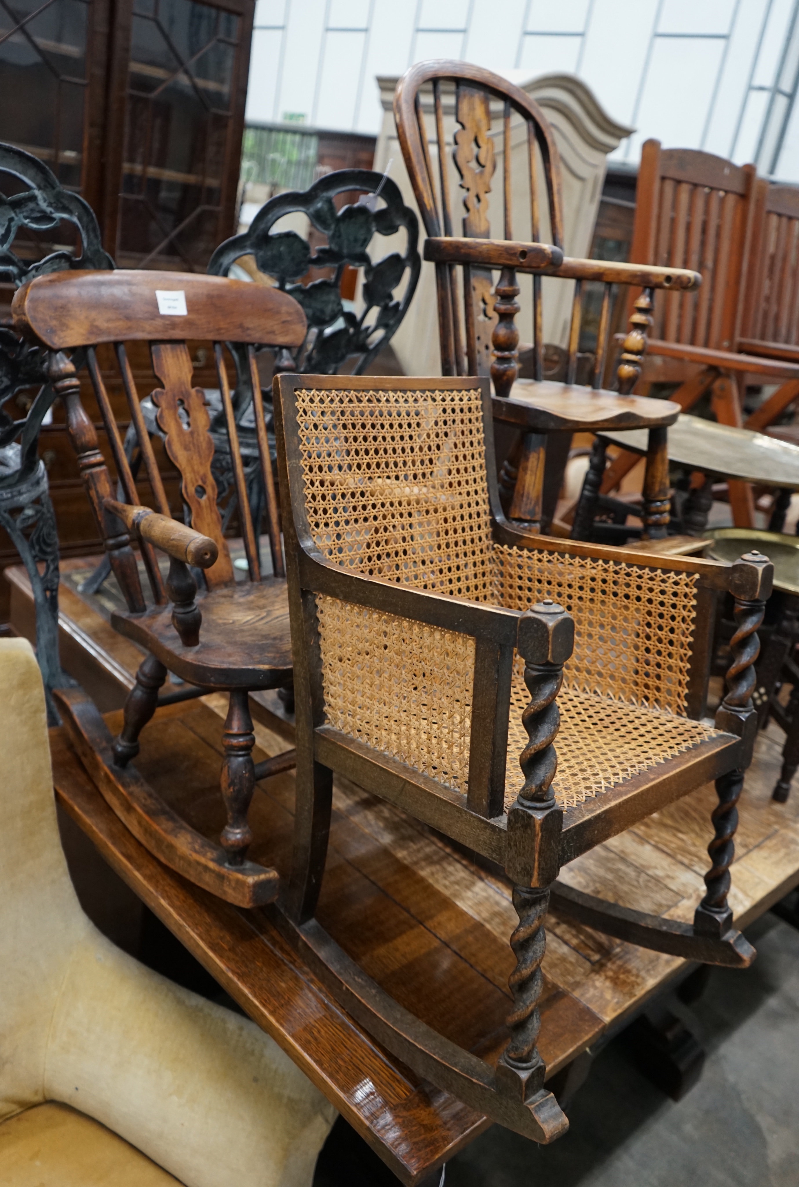 A Victorian elm and beech Windsor child's rocking chair, a Victorian style Windsor high chair and one other child's chair